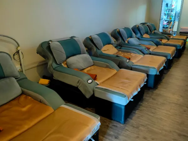 Large sofa for clients' foot massage.